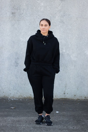 woman wearing loungewear hoodie and joggers in midnight black