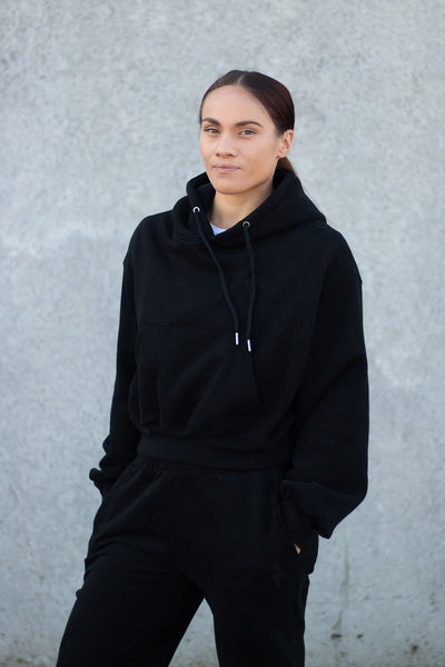 woman wearing loungewear hoodie in midnight black