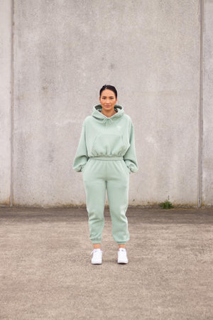 woman wearing loungewear hoodie and joggers in mint