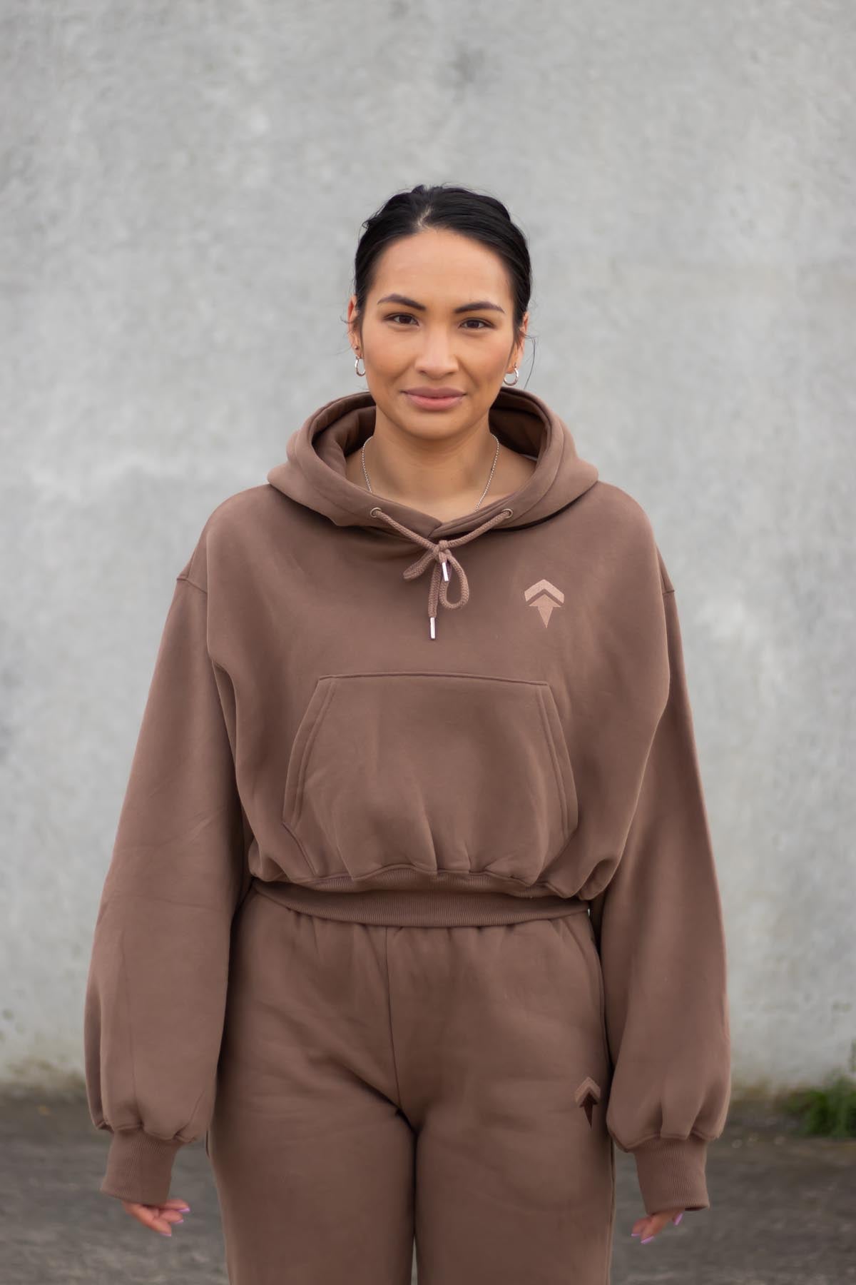 woman wearing loungewear hoodie in chocolate
