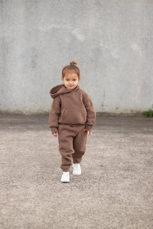 girl wearing loungewear set in chocolate