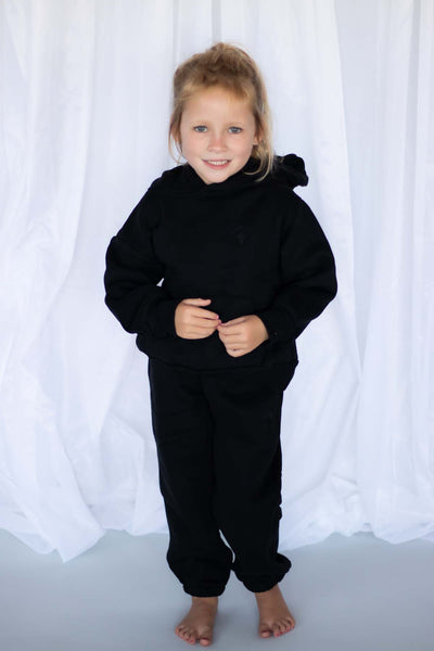 girl wearing loungewear set in black
